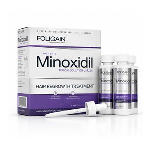 Foligain Minoxidil Women's Hair Regrowth Treatment shown with its retail box, three silver topical solution bottles, and a white dropper on a clean white background.